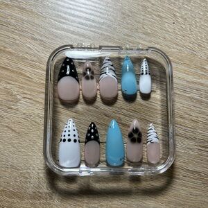 Stylish Press-On Nail Set with Black and Blue Designs